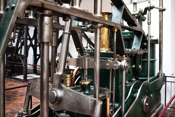 Steampunk texture made of metal pipes, levers, pistons; suckes, plungers.