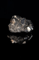 Pyrite with dodecahedron formation on black background