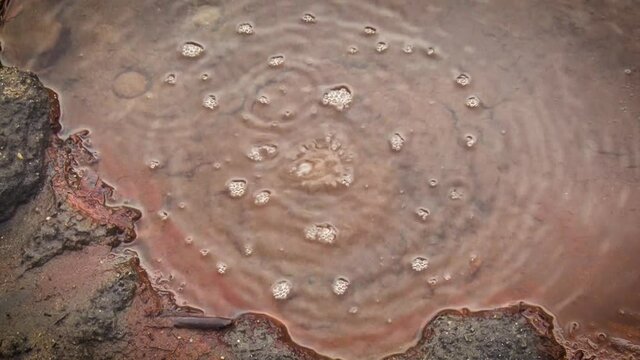 A closeup view of a seething geyser.