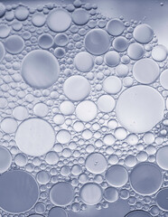 Abstract oil and water droplets on circle theme.