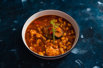 plant-based food, vegan butter beans stew in earthy tomato sauce with smoked aubergines