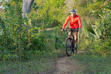 Obraz premium Man mountain biking in Dominican Republic. .