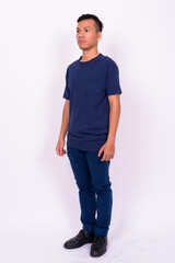 Portrait of young Asian man with beard stubble