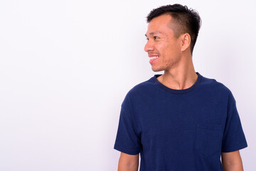 Obraz premium Portrait of happy young Asian man with beard stubble
