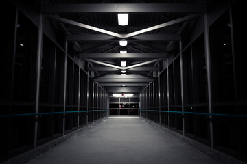 Image of a symmetrical bridge in a dark tunnel