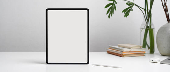 Close up view of digital tablet and stylus pen on white table, clipping path.