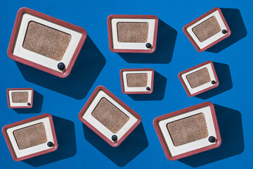 Background of retro radios on a blue background.