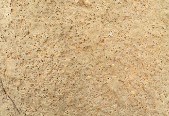 Brown graveled wall. Mixed mineral and rock texture