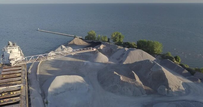 A Large Gravel Slinger At Work In A Sand Quarrying Plant By The Sea In Kingsville, Ontario, Canada - aerial