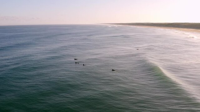 Drone shooting of surfers on the beach of "Courant d'Huchet" in the "Landes" in France.