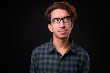 Obraz premium Portrait of young Asian hipster man with curly hair