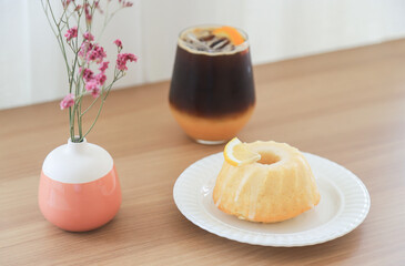 Americano iced coffee with lemon cake in home 
