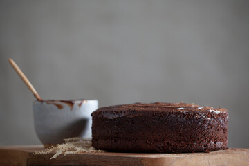 Preparation of a vegan chocolate cake on a cutting board