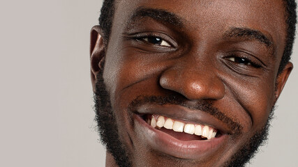 close up face of African American smiling positively to the camera