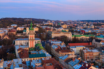 Fototapeta na wymiar Aerial view of Assumption church and historic center of Lviv, Ukraine. Lvov cityscape. View from Lviv Town Hall