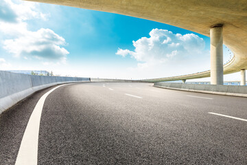 Asphalt road and viaduct with blue sky in shanghai.