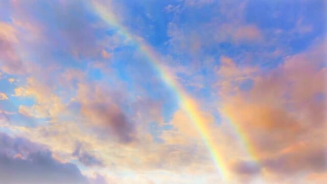 Blue sky Time lapse with colorful rainbow.
