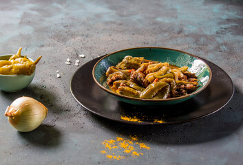 Eggplant dish served on the plate on the table