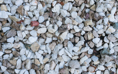
Background from sea pebbles of different colors. View from the top.