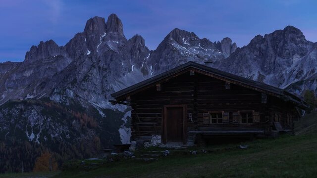 Awesome mountain scenary with Hut in the Front with soft Sunlight, complete Sunrise
