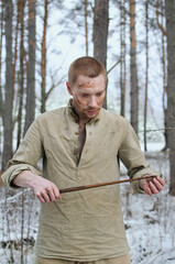 soldier in the uniform of the second world war noyna in the winter forest