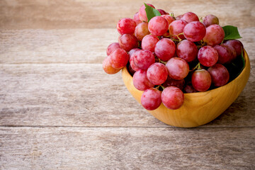 red grapes on a wooden table