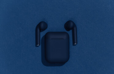 Classic blue true wireless bluetooth headphones or earbuds with charging case. Color 2020. Top...