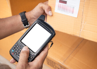 Closeup worker scanning barcode scanner on parcel box. Shipment,  Computer equipment for warehouse inventory management.