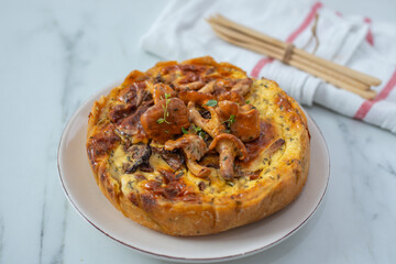 Home made quiche with chanterelles 
