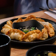 Fried Korean vegetable dumplings and sauce