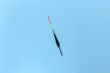 Fishing float on a blue background. Top view