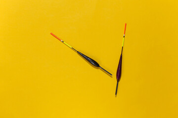 Two fishing floats on yellow background. Top view © splitov27