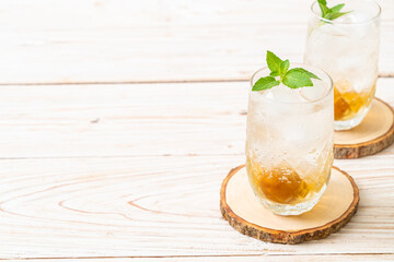 iced plum juice with soda and peppermint