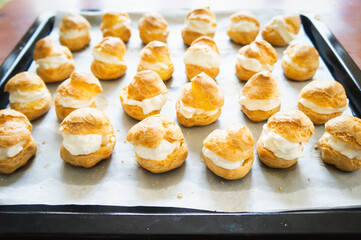 A tray of golden cream puffs