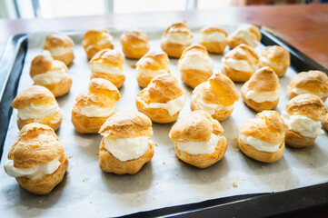 A tray of golden cream puffs