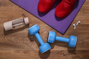 Accessories for sports or fitness on wooden floor. Athlete's set. Healthy lifestyle concept, sports.