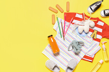 Travel accessories for children on color background