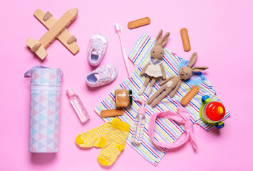 Travel accessories for children on color background