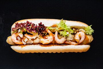 hot dog on the black background