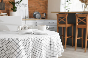 Dining table in interior of modern kitchen