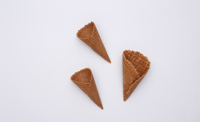 Ice cream waffle cones on white background. Top view