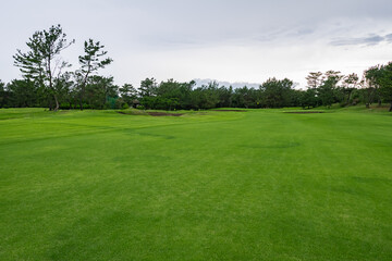 Obraz na płótnie Canvas Golf Course with beautiful green field. Golf course with a rich green turf beautiful scenery.