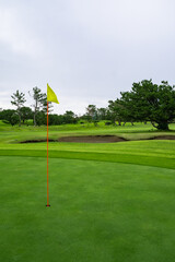 View of Golf Course with beautiful putting green. Golf course with a rich green turf beautiful scenery.