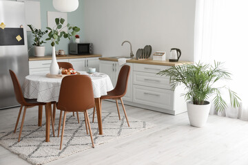 Interior of stylish modern kitchen with dining table
