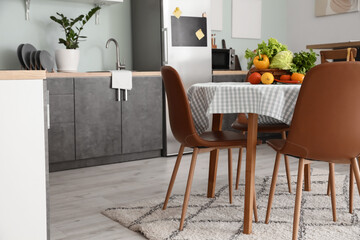 Interior of stylish modern kitchen with dining table