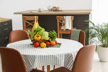 Dining table in interior of modern kitchen