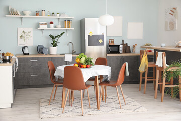 Interior of stylish modern kitchen with dining table