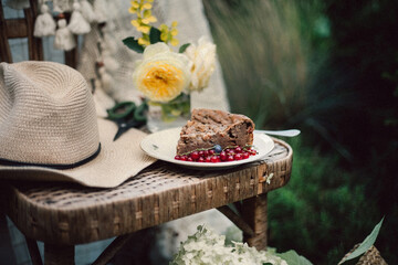 chocolate cake and flowers in the garden, cottagecore style