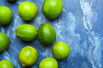 Fresh green limes on color background