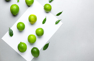 Fresh green limes on light background